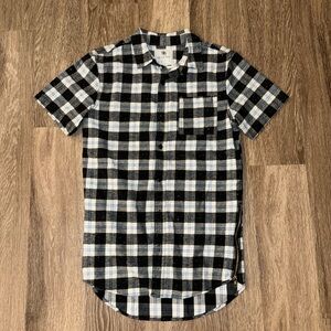 Plaid shirt with side zippers.
